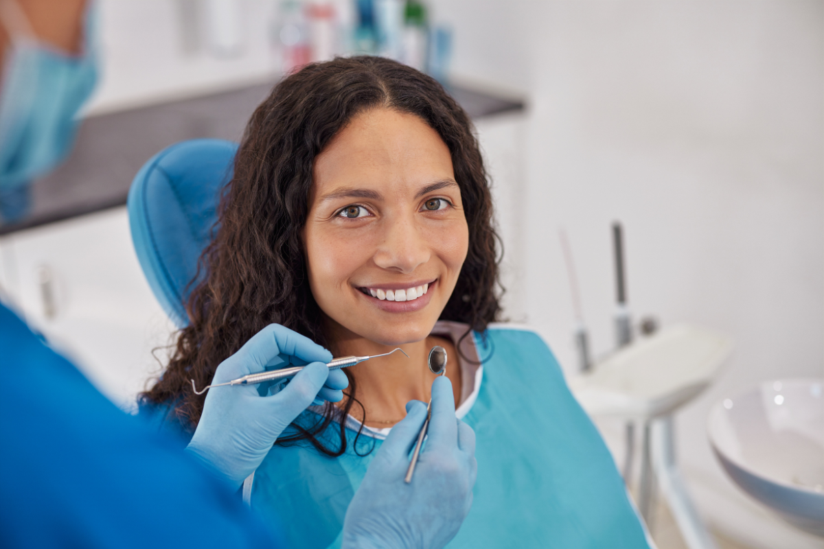 How to Maintain the Best Results After TMJ Treatment in Duxbury Smiling patient receiving TMJ treatment examination at Duxbury dental practice.